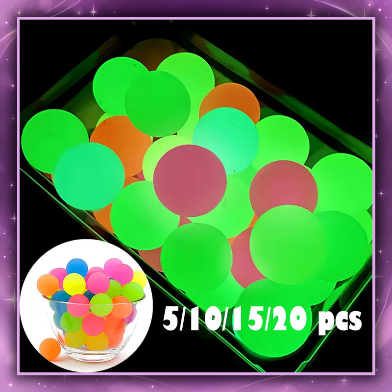 Glow-in-the-dark colorful bouncy balls on a deep lavender star and heart background